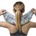 Boomerang neck heat pack held across the shoulders, close up
