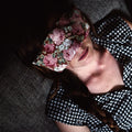 SpotPack floral eye pillow resting over closed eyes