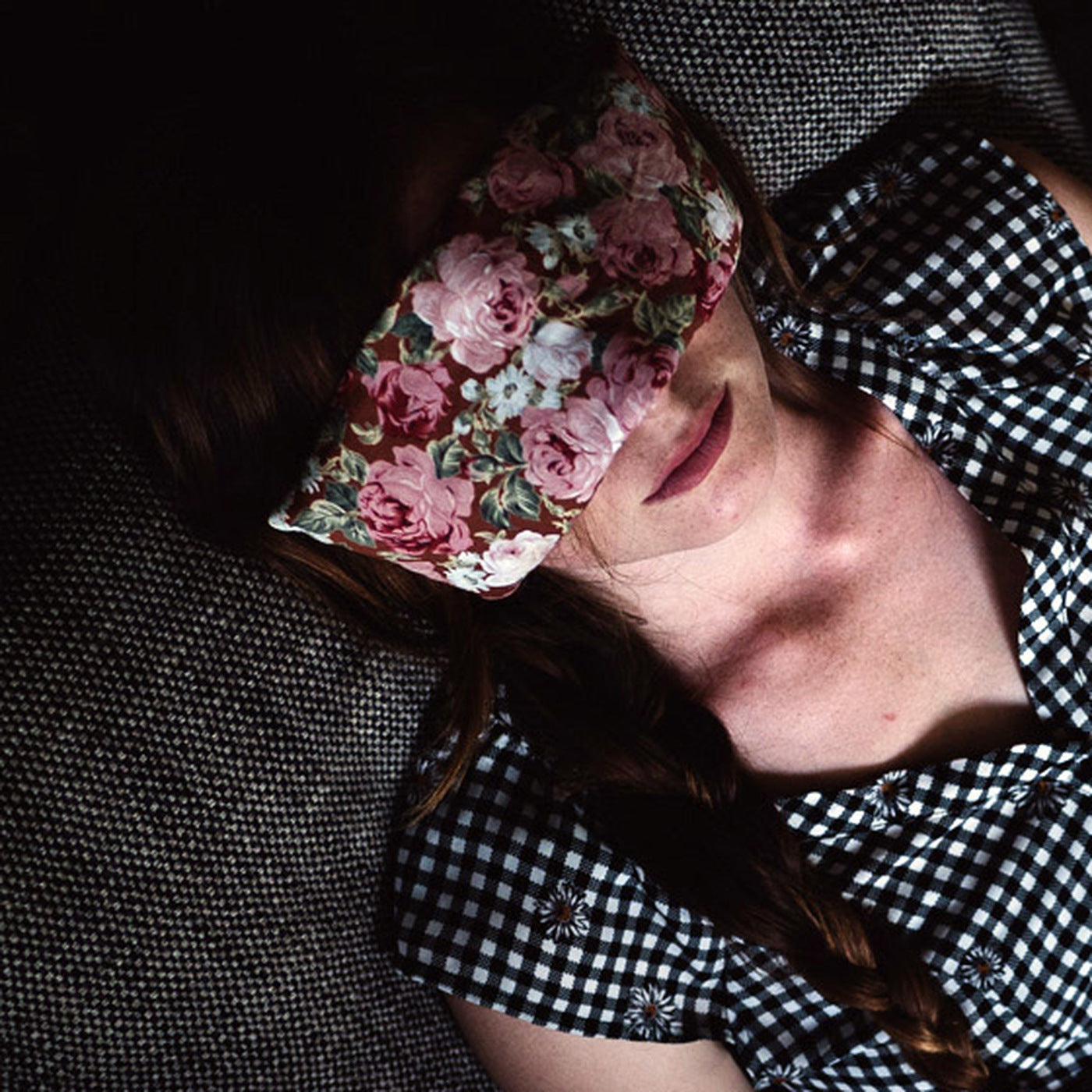 SpotPack floral eye pillow resting over closed eyes