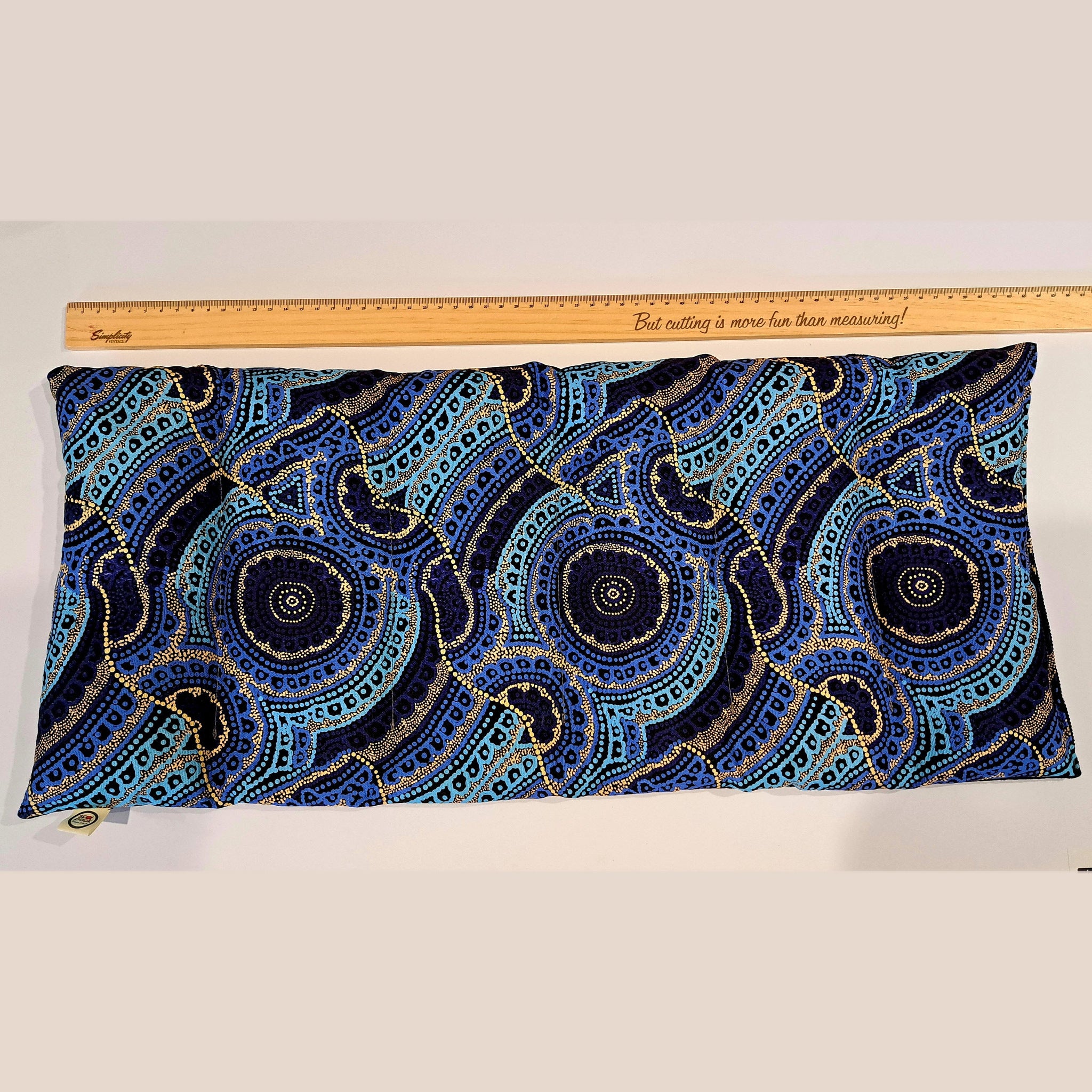 Mega Large heat pack laid flat beside a ruler, showing its full length